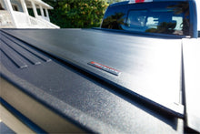Load image into Gallery viewer, Roll-N-Lock 15-17 Chevy Silverado/Sierra 2500/3500 77-3/8in E-Series Retractable Tonneau Cover